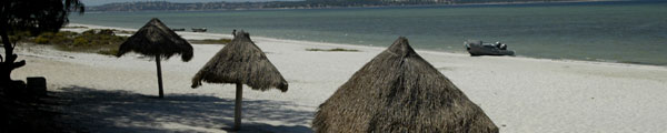 Beautiful sandy beaches surround the lagoon at Beline